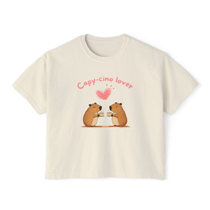 Beige women's boxy t-shirt with illustration of two capybaras enjoying coffee and heart shape above