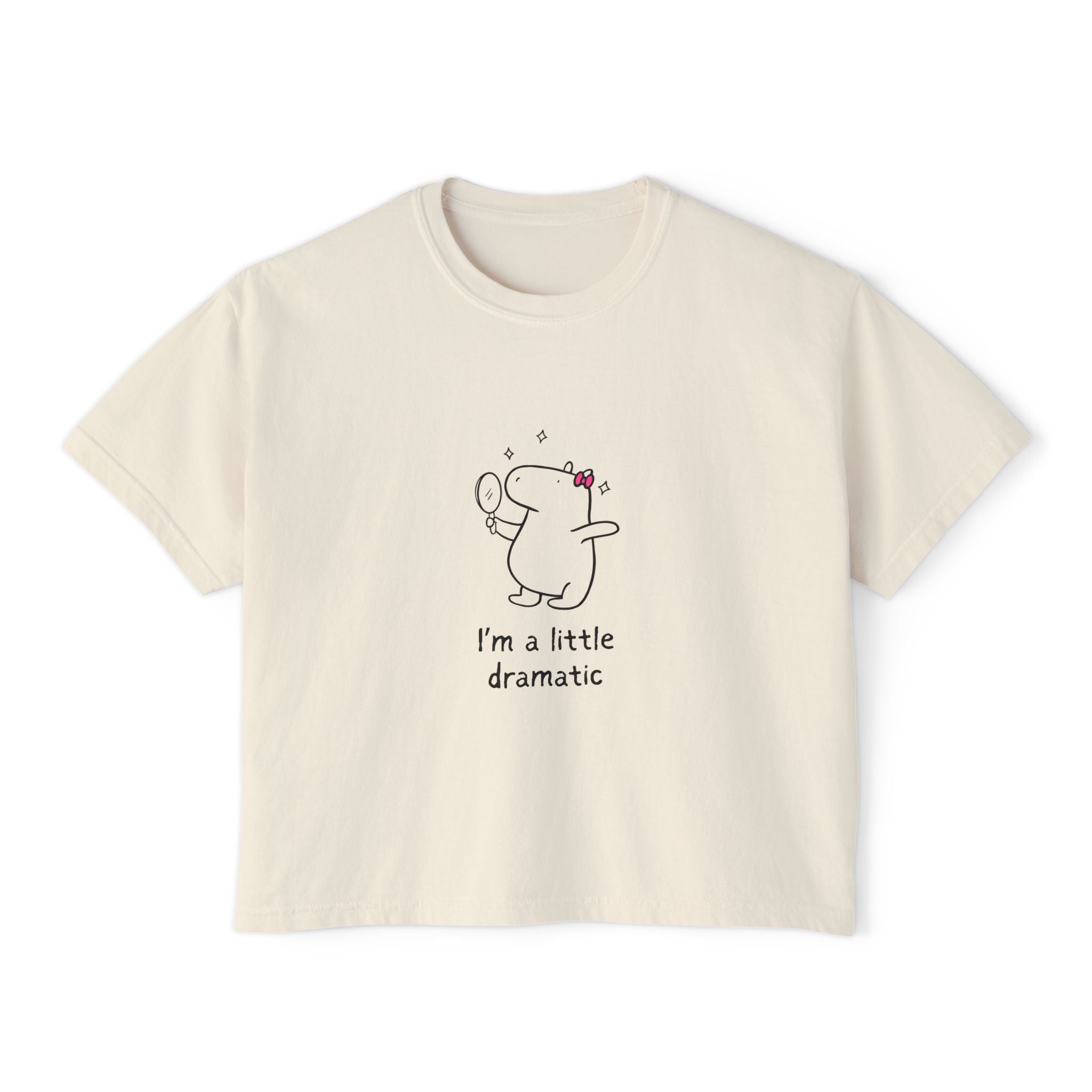 Beige t-shirt with a cartoon capybara and text on a white background