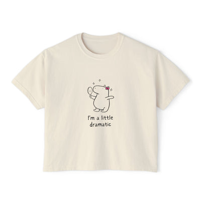 Beige t-shirt with a cartoon capybara and text on a white background
