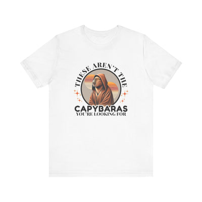 White unisex jersey t-shirt with graphic illustration of a hooded figure and text "These Aren't the Capybaras You're Looking For