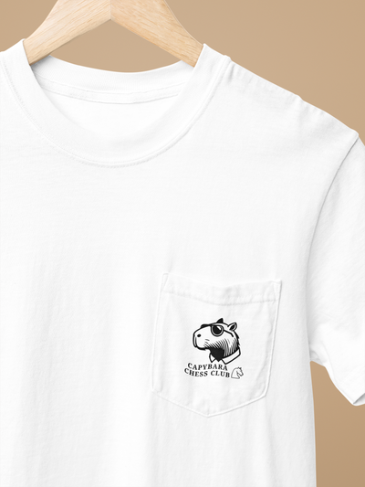 White t-shirt with front pocket featuring a black and white capybara logo and "Capybara Chess Club" text