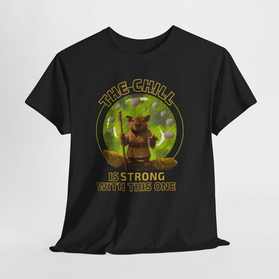 Black t-shirt with a graphic of a chill capybara wearing a Jedi robe and holding a walking stick, surrounded by green foliage and bubbles, with text "The Chill Is Strong With This One" in yellow.