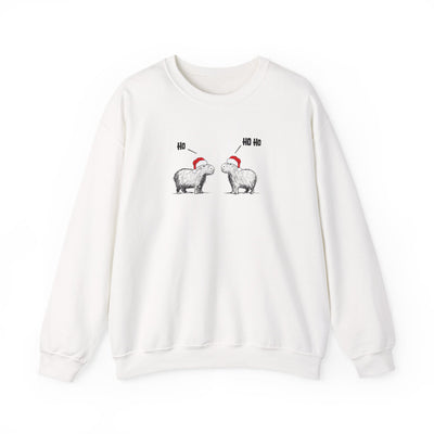 White crewneck sweatshirt featuring a graphic of two capybaras wearing red Santa hats facing each other with 'HO HO HO' text above them