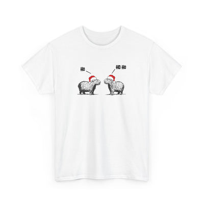 A white short-sleeve crewneck t-shirt featuring a graphic of two fluffy capybara wearing red Santa hats, with 'Ho Ho Ho' text above them, displayed on a clean white background.