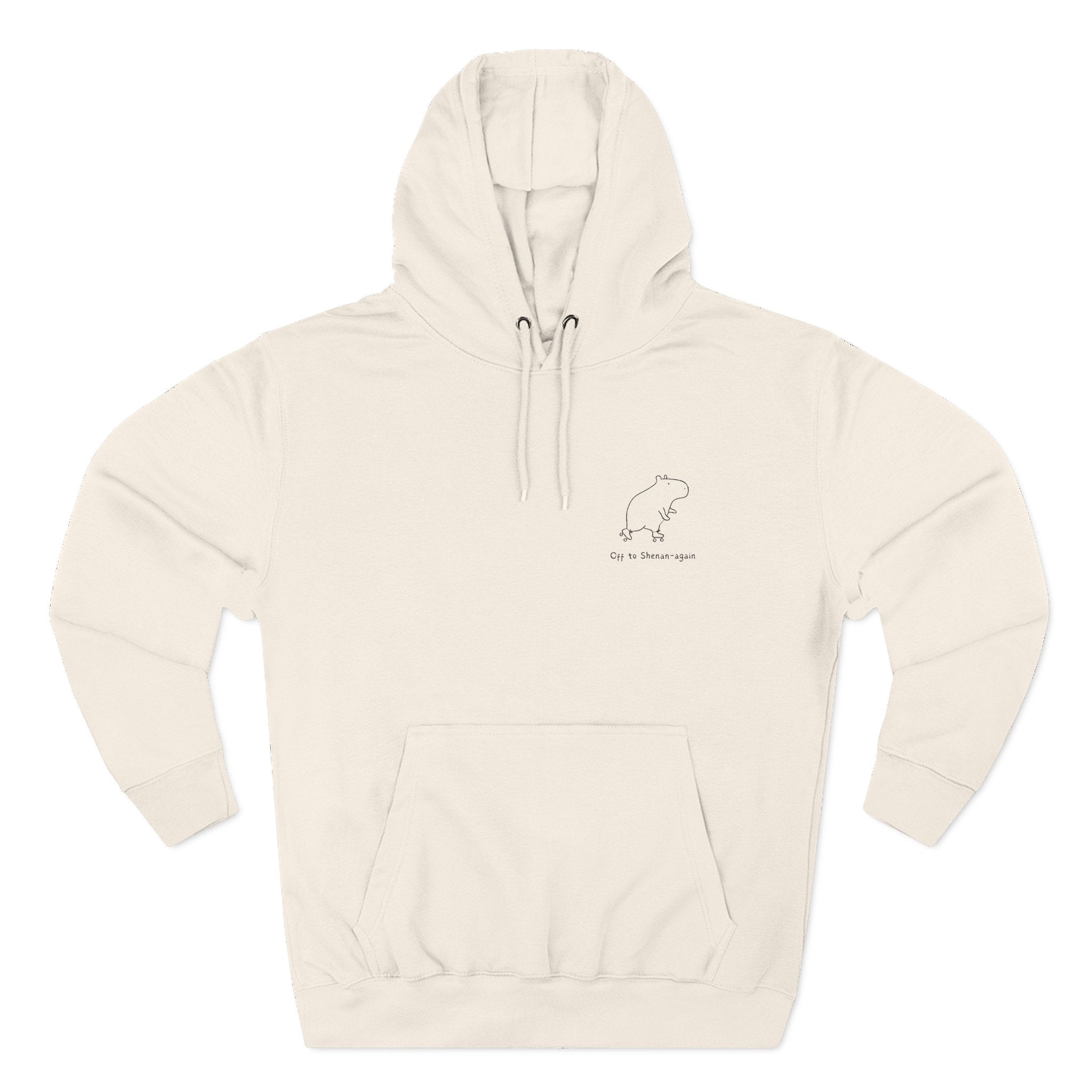 Cream-colored pullover hoodie with minimalist capybara embroidery and text "Off to Shenan-again