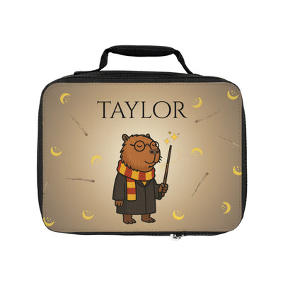 Personalized lunchbox featuring a cartoon bear character dressed in wizard attire against a starry night background, with the name "Taylor" prominently displayed.