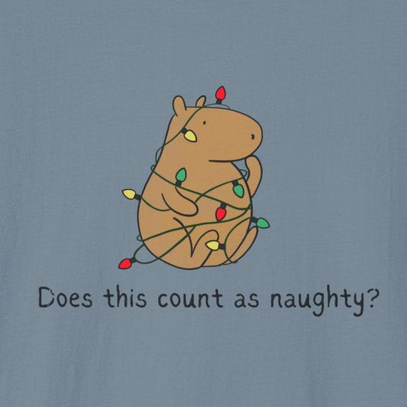 Blue tee with a capybara tangled in christmas lights and the humorous phrase "Does this count as naughty?"
