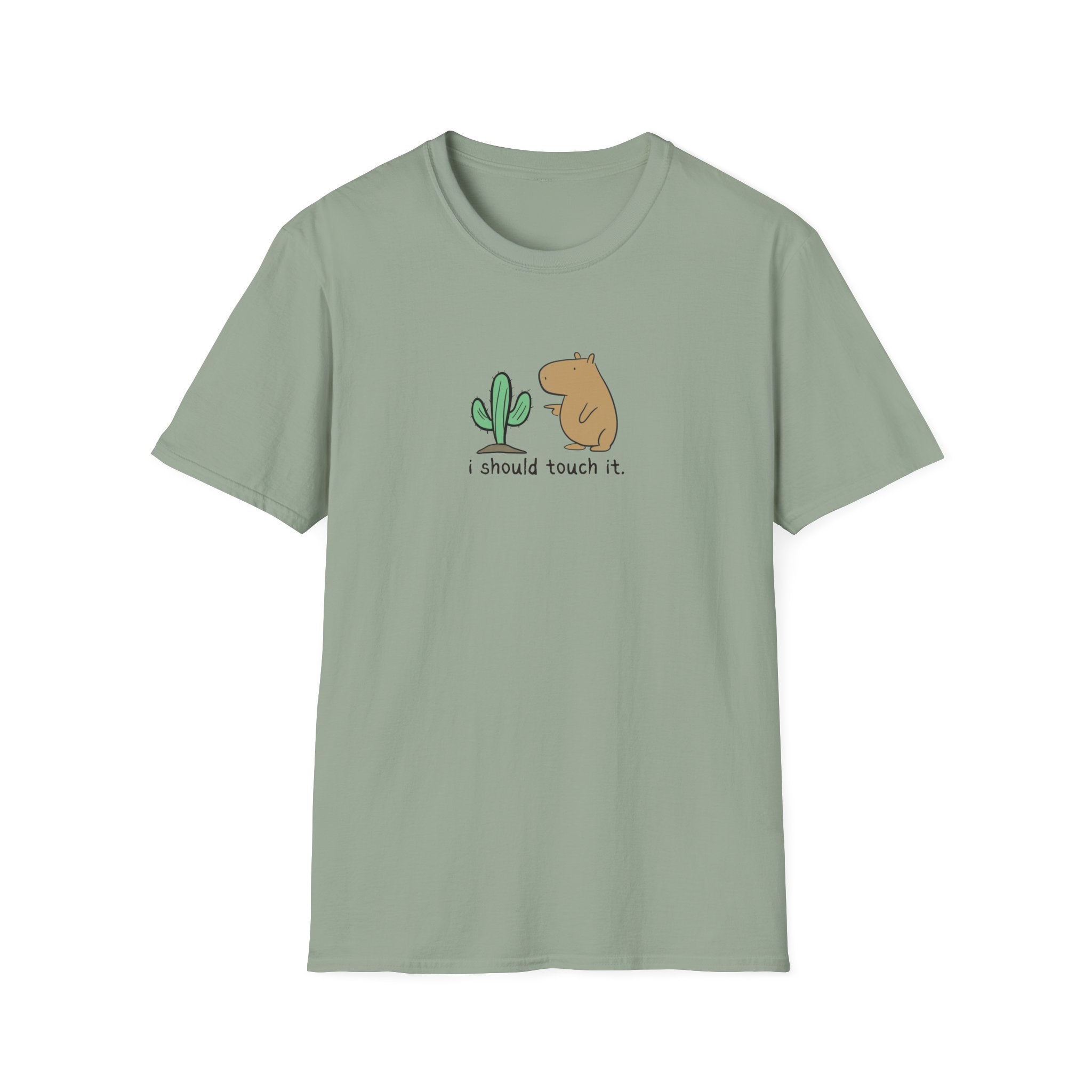 A sage green short-sleeve crewneck t-shirt featuring a cute graphic of a small green cactus and a brown capybara with the text 'i should touch it.' printed on the chest, displayed against a solid white background.