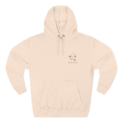 Cream-colored hoodie with minimalist capybara graphic and text "How did I get here?