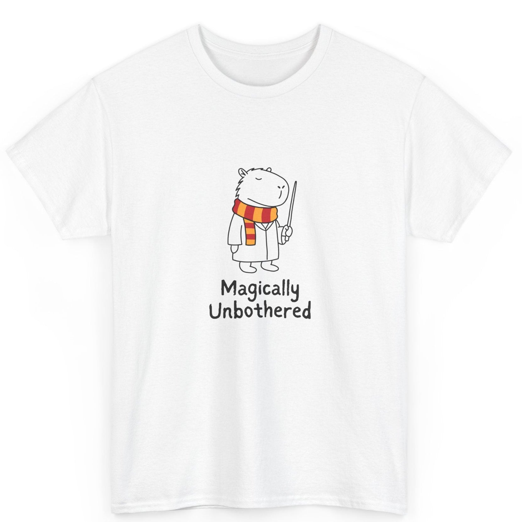 White t-shirt with a cartoon  capybara character and 'Magically Unbothered' text on a white background