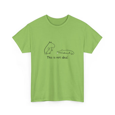 Green t-shirt with a capybara and alligator graphic and text 'This is not ideal' on a white background