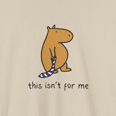 Beige t-shirt with a graphic of a capybara and text 'this isn't for me' 