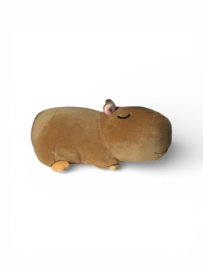 Capybara plush toy side profile on white background showing soft brown velvet fur
