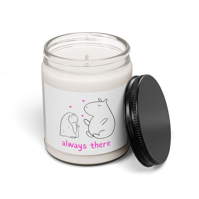 Capy Life Always There soy candle in a glass jar with a black lid, featuring a capybara doodle and pink hearts.