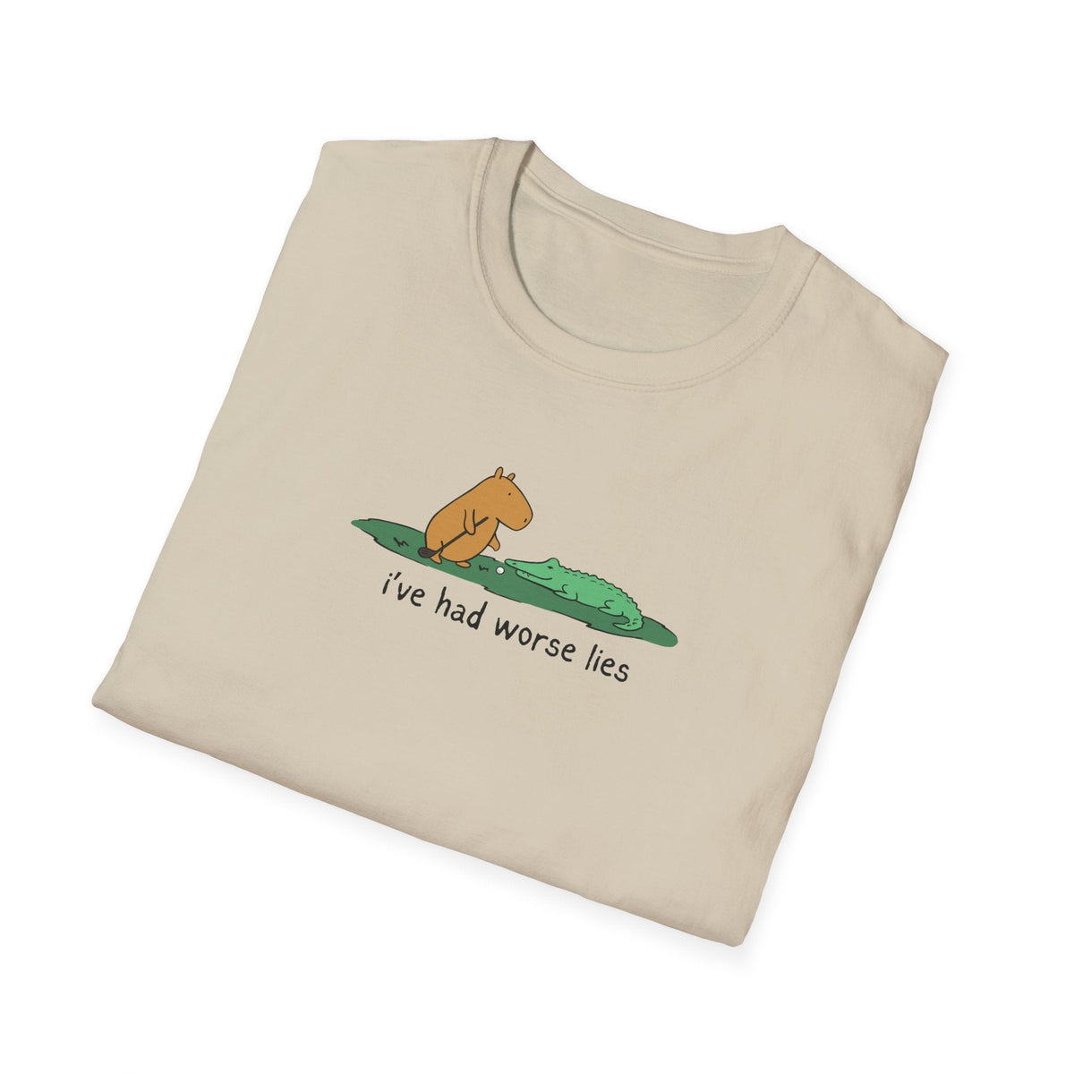 Capy Life softstyle t-shirt in beige featuring a hand-drawn capybara and alligator with the text I've had worse lies.