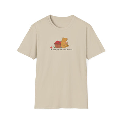 Capy Life softstyle t-shirt in beige featuring a hand-drawn capybara eating a cider donut next to a basket of apples.