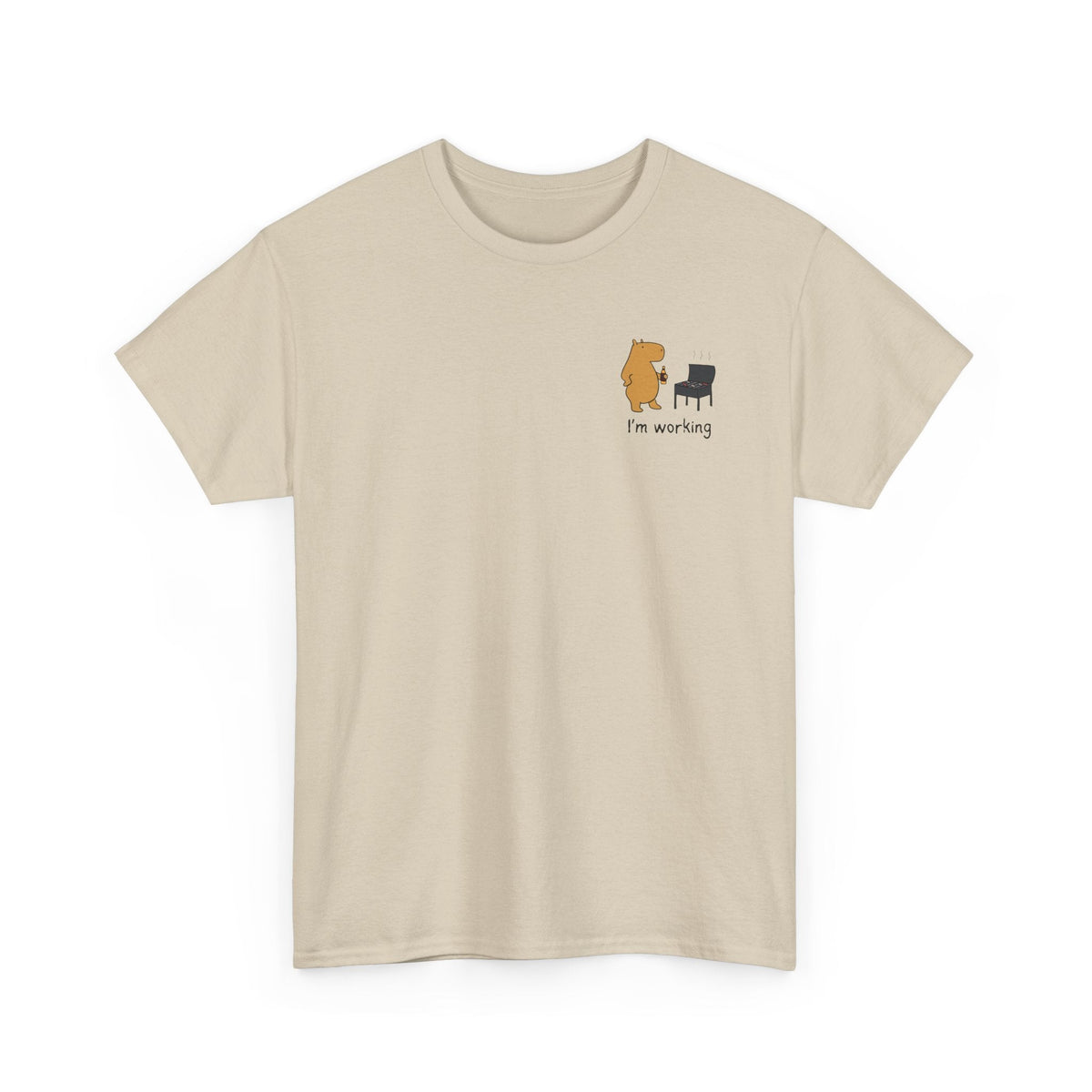 Capy Life beige heavyweight t-shirt featuring a small left chest graphic of a capybara grilling with a drink.