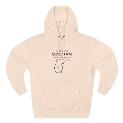 Capy Life premium beige hoodie featuring Gene the Capybara line art and the text I wonder if chocolate thinks about me