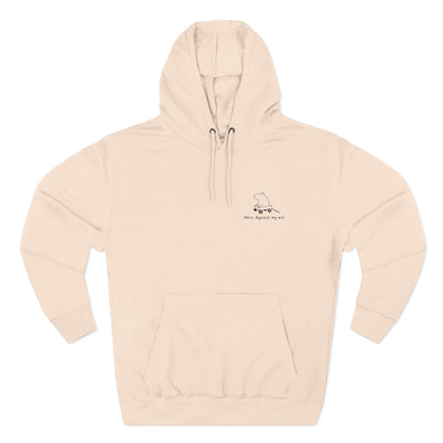 Capy Life beige premium hoodie featuring a small embroidered capybara in a wagon with the text Here Against My Will