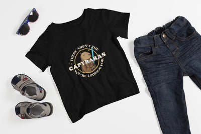 Capy Life black youth t-shirt featuring a comic-style Jedi capybara graphic with a lightsaber and Star Wars parody text.