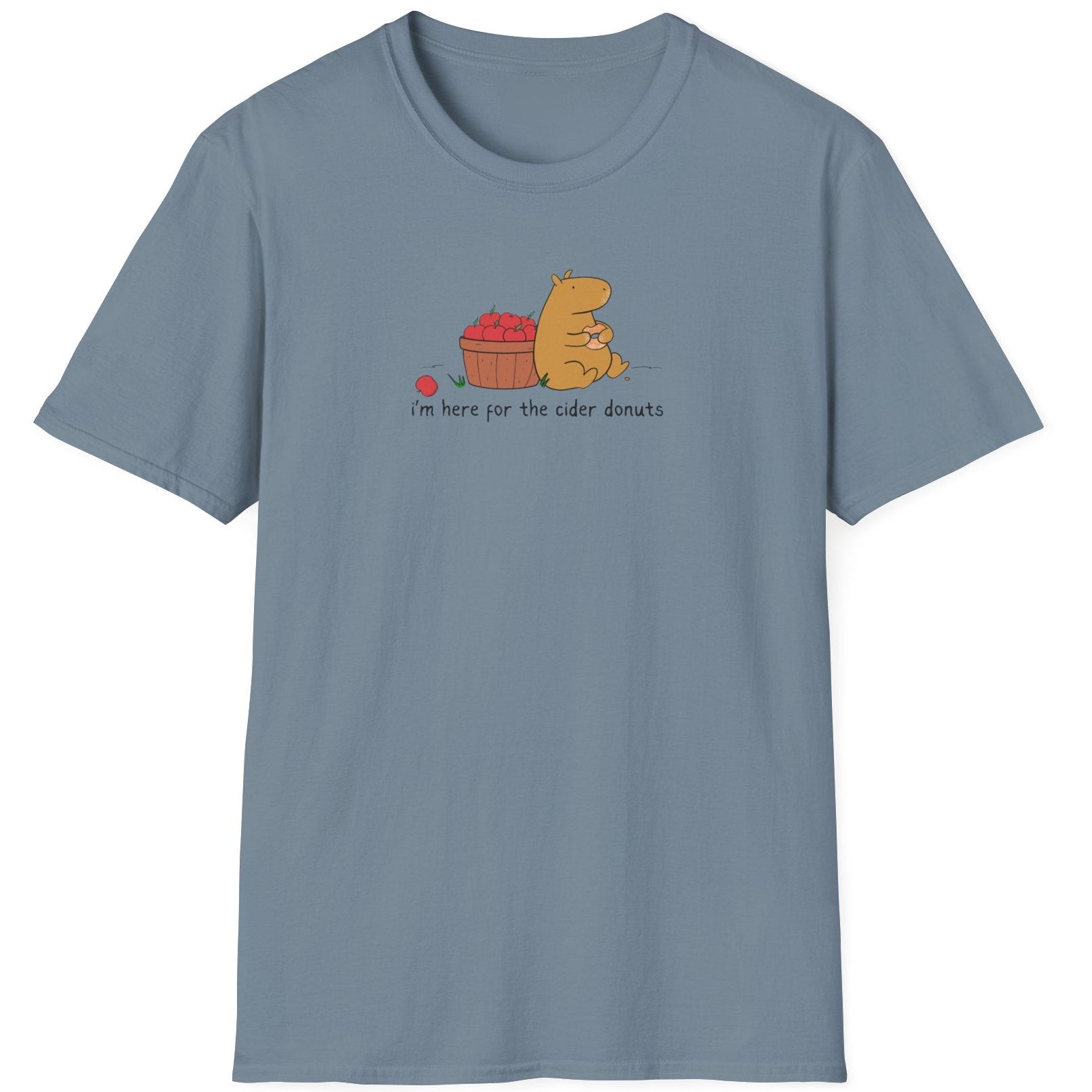 Capy Life blue softstyle t-shirt with a hand-drawn capybara eating a cider donut next to a basket of apples.