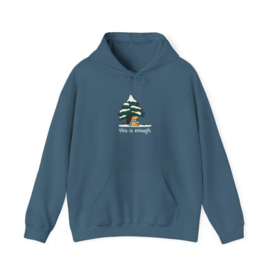 Capy Life blue pullover hoodie featuring a graphic of a capybara under a snowy tree with the text this is enough.