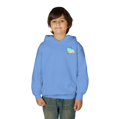 A young boy wearing a Capy Life light blue pullover hoodie with a small capybara graphic on the chest.