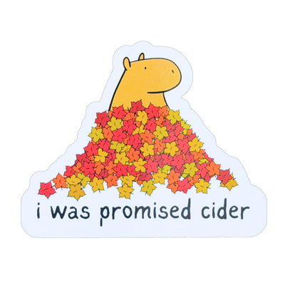 Capy Life die-cut sticker featuring a capybara in a pile of autumn leaves with the text I was promised cider