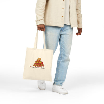 Capy Life natural canvas tote bag featuring a funny capybara in autumn leaves with the text I was promised cider