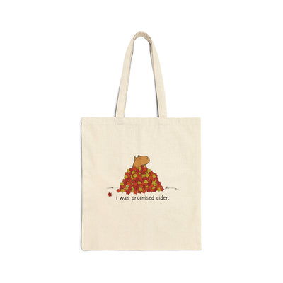 Capy Life natural canvas tote bag featuring a hand-drawn capybara in autumn leaves with the text I was promised cider