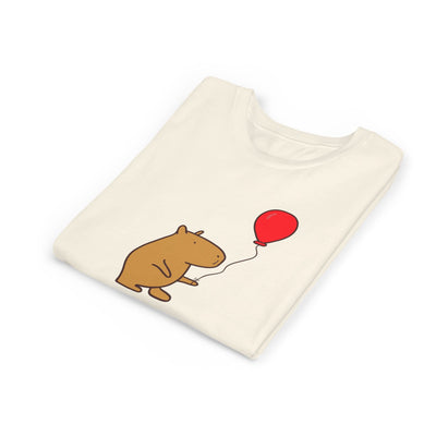 Capy Life youth t-shirt in cream featuring a cute capybara holding a red balloon with the text Up to Something