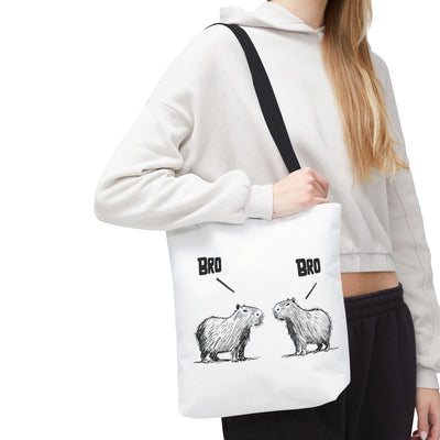 Capy Life premium white canvas tote bag featuring a minimalist sketch of two capybaras saying Bro to each other.
