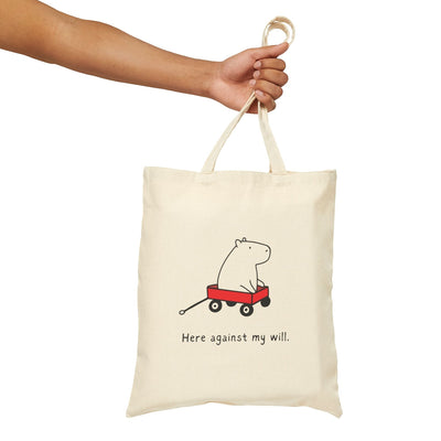 Capy Life natural canvas tote bag featuring a minimalist illustration of a capybara in a red wagon with funny text.
