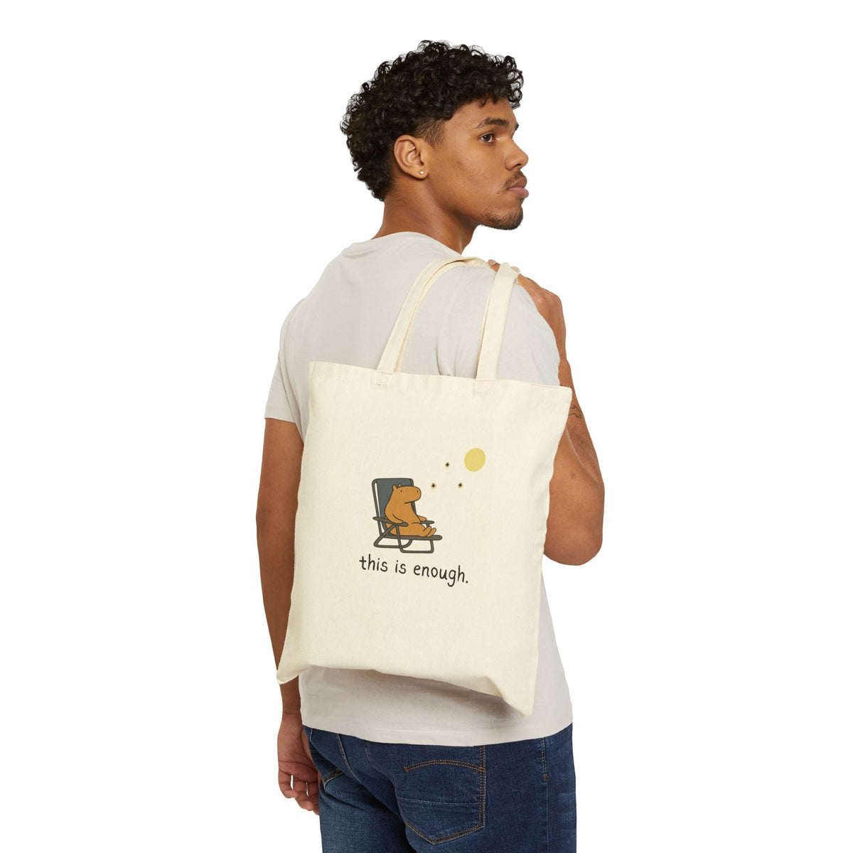 Capy Life canvas tote bag featuring a capybara in a chair under the moon with the text this is enough on a model