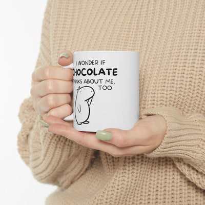Capy Life white ceramic mug featuring a hand-drawn capybara and the text I wonder if chocolate thinks about me too