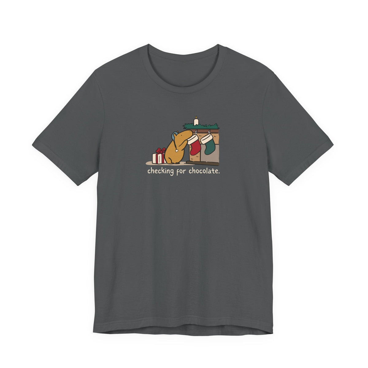 Capy Life charcoal grey softstyle t-shirt featuring a hand-drawn capybara checking a Christmas stocking for chocolate.