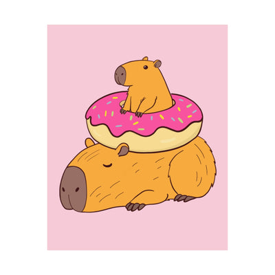 Capy Life wall art print featuring a cute capybara sleeping under another capybara sitting inside a frosted donut.