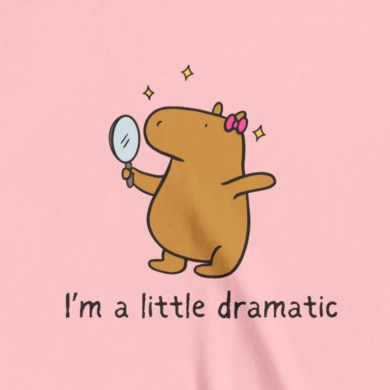 Capy Life youth tee featuring a cute capybara with a pink bow holding a mirror with sparkles and text I am a little dramatic