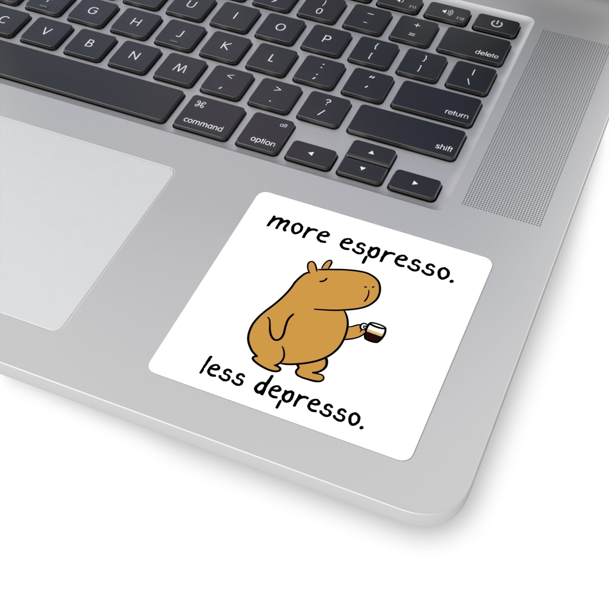 Capy Life vinyl sticker on a laptop featuring a cute capybara holding an espresso cup with funny coffee text.
