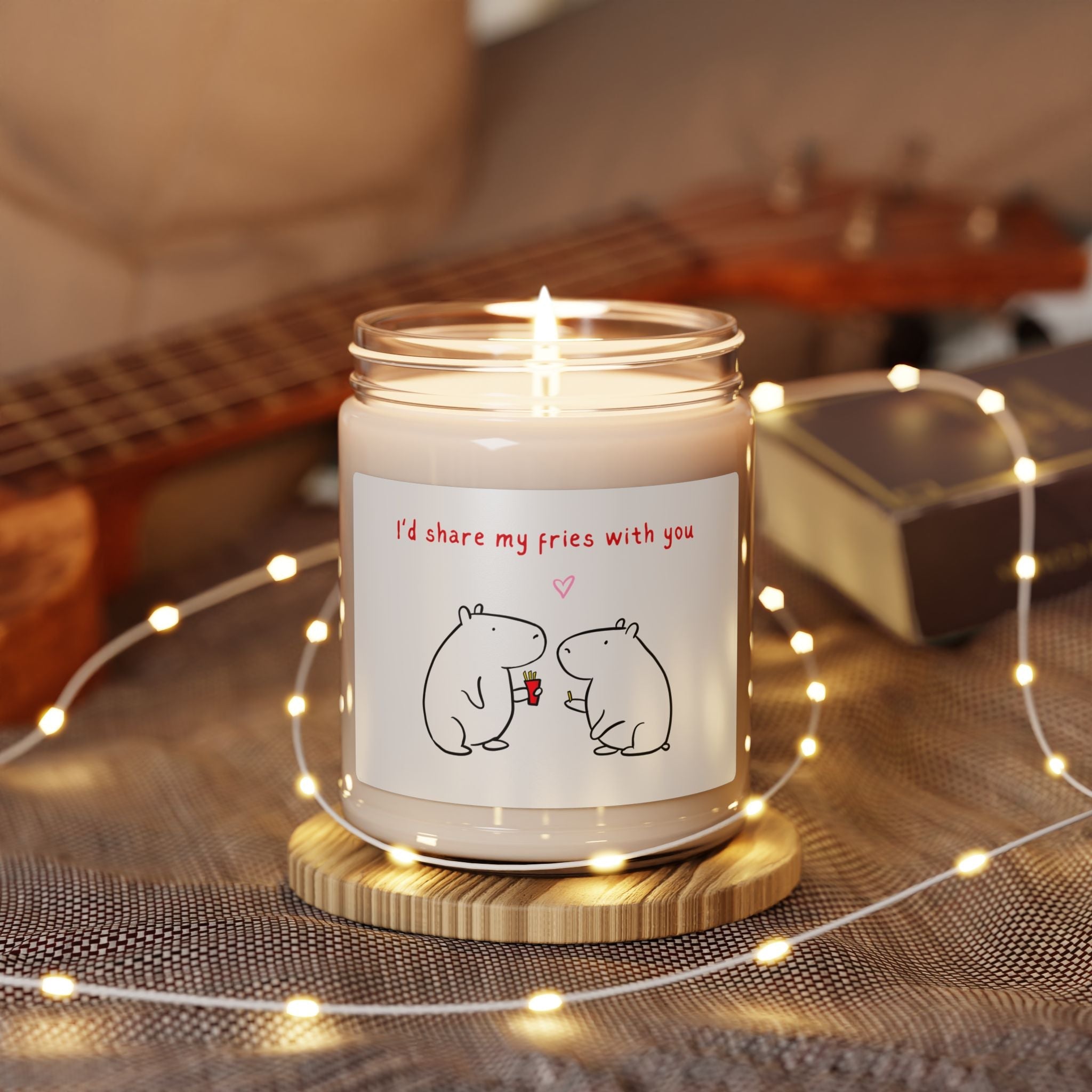 Capy Life soy candle in a glass jar with a cute capybara illustration and I'd share my fries with you text