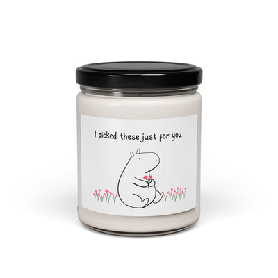 Capy Life passionfruit scent soy wax candle in a glass jar with a cute capybara illustration holding flowers and a thoughtful message.