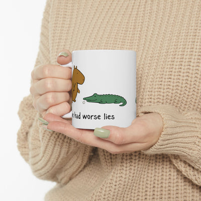 Capy Life white ceramic coffee mug featuring a capybara and alligator illustration with the text I've had worse lies