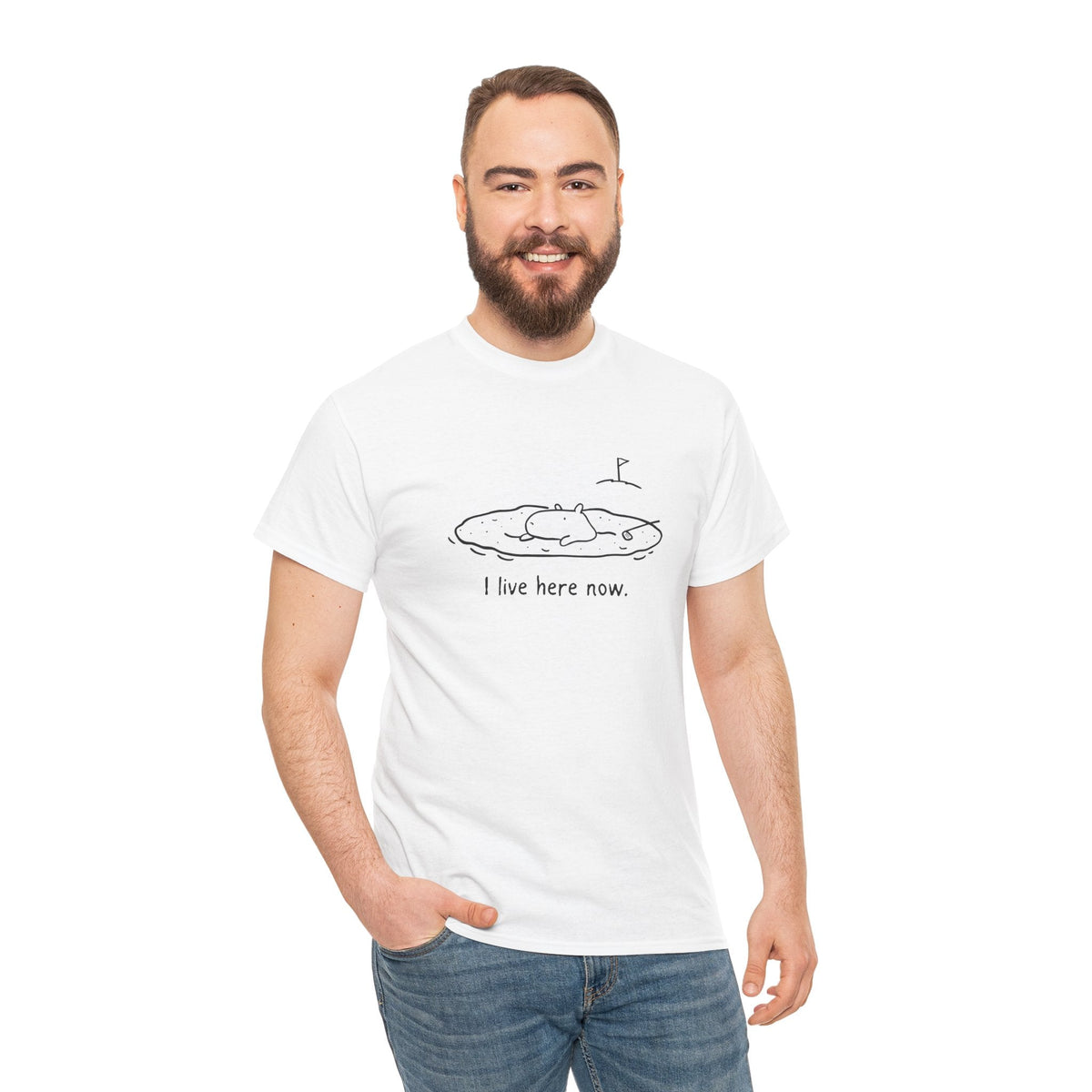 Capy Life white t-shirt featuring a minimalist doodle of a capybara in a golf sand bunker with the text I live here now