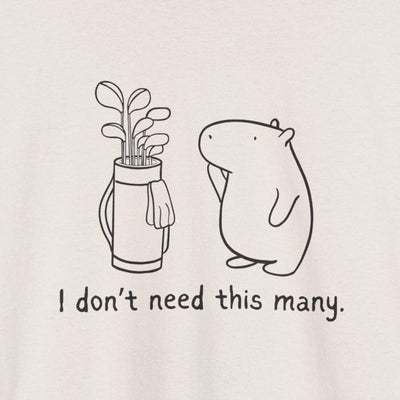 Capy Life heavy tee featuring a minimalist line drawing of a capybara standing next to a full golf bag with text.