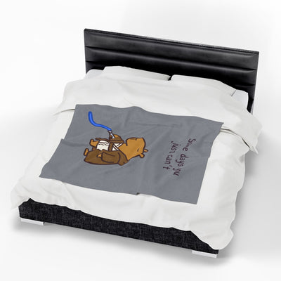 Capy Life velveteen plush blanket featuring a tired capybara Jedi illustration on a grey background, draped on a bed.