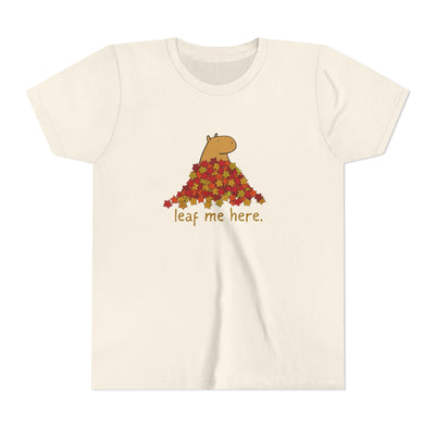 Capy Life youth t-shirt in cream featuring a capybara in a pile of autumn leaves with the text leaf me here
