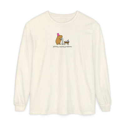 Capy Life long sleeve tee in cream featuring a capybara in a pink top hat with the text politely causing problems.