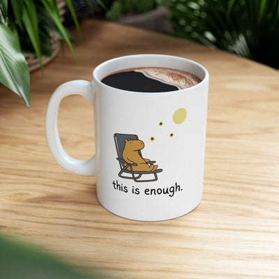Capy Life white ceramic mug featuring a hand-drawn capybara in a chair under the moon with the text this is enough.