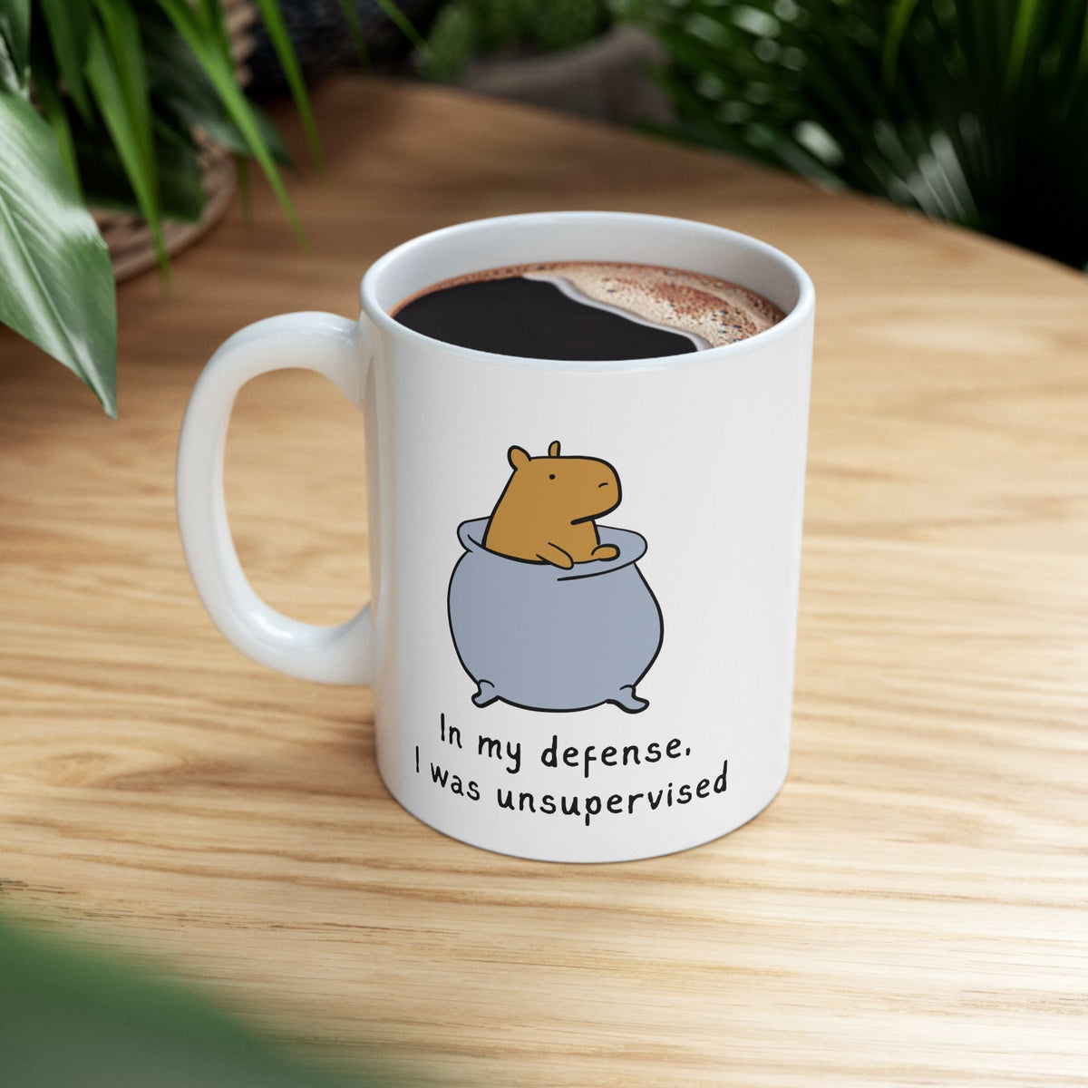 Capy Life white ceramic coffee mug featuring a cute capybara in a pot with the text In my defense I was unsupervised