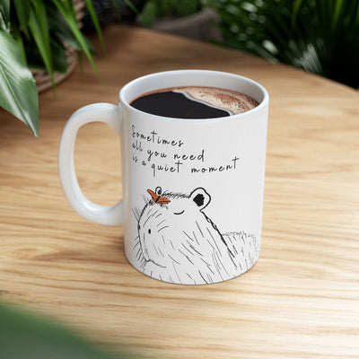Capy Life white ceramic mug featuring a hand-drawn capybara with a butterfly and the quote Sometimes all you need is a quiet moment